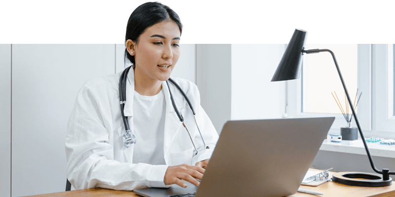 healthcare professional entering information into a patient's electronic health record